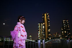 Rule 34 | 1girl, cityscape, hairband, japanese clothes, kimono, night, photo (medium), shio, sky, solo, strawberry pattern, waterfront