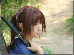 Rule 34 | cosplay, himura kenshin, himura kenshin (cosplay), lowres, photo (medium), red hair, rurouni kenshin, sword, weapon