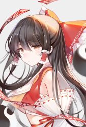 Rule 34 | 1girl, black hair, bow, brown eyes, chinese commentary, closed mouth, commentary request, detached sleeves, frilled hair tubes, frills, grey background, hair between eyes, hair bow, hair tubes, hakurei reimu, long hair, looking at viewer, midriff, ofuda, ookamisama, red bow, simple background, solo, touhou, upper body, yin yang