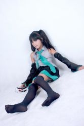 Rule 34 | black hair, cosplay, detached sleeves, hatsune miku, hatsune miku (cosplay), long hair, no shoes, photo (medium), thighhighs, twintails, vocaloid