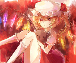 Rule 34 | 1girl, blonde hair, closed mouth, collared shirt, crystal, feet out of frame, flandre scarlet, frilled shirt collar, frilled skirt, frilled sleeves, frills, glowing, glowing wings, hair between eyes, hat, holding, holding stuffed toy, kneehighs, looking at viewer, medium hair, mob cap, multicolored wings, one side up, puffy short sleeves, puffy sleeves, red background, red eyes, red skirt, red theme, red vest, remokawa, shirt, short sleeves, skirt, skirt set, socks, solo, stuffed animal, stuffed toy, teddy bear, touhou, vest, white hat, white shirt, white socks, wings