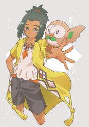 Rule 34 | 1boy, creatures (company), cropped legs, dark-skinned male, dark skin, game freak, gen 7 pokemon, green eyes, green hair, grey background, hand on own hip, hau (pokemon), hau (sygna suit) (pokemon), highres, jewelry, looking at viewer, male focus, miyopippi, necklace, nintendo, official alternate costume, outstretched arm, pokemon, pokemon (creature), pokemon masters ex, pokemon on arm, rowlet, shirt, signature, smile, solo, wings