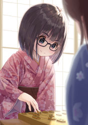 Rule 34 | 2girls, black hair, blue eyes, blue kimono, blunt bangs, blush, board game, brown sash, commentary request, floral print, glasses, highres, holding, japanese clothes, kimono, long sleeves, looking down, mimikaki (men bow), multiple girls, obi, original, pink kimono, playing, print kimono, sash, shogi, shogi piece, short hair, smile, thick eyebrows, upper body, wide sleeves, window