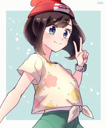 Rule 34 | 1girl, bad id, bad twitter id, beanie, blush, border, bracelet, brown hair, closed mouth, commentary request, creatures (company), eyelashes, floral print, game freak, green shorts, grey eyes, hand up, hat, highres, jewelry, nintendo, outside border, pokemon, pokemon sm, red hat, selene (pokemon), shirt, shorts, signature, smile, solo, tere asahi, tied shirt, v, white border, yellow shirt, z-ring