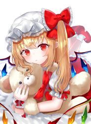 Rule 34 | 1girl, ankle socks, blonde hair, blush, commentary, expressionless, flandre scarlet, hat, hat ribbon, holding, holding stuffed toy, leg lift, looking at viewer, lying, mary janes, mob cap, on bed, on stomach, one side up, petticoat, pointy ears, puffy short sleeves, puffy sleeves, red eyes, red footwear, red skirt, red vest, ribbon, sakizaki saki-p, shirt, shoes, short sleeves, simple background, skirt, socks, solo, stuffed animal, stuffed toy, teddy bear, touhou, twitter username, vest, white background, white hat, white shirt, white socks, wings, wrist cuffs
