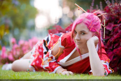 Rule 34 | 1girl, cosplay, grass, haruno sakura, legs, looking at viewer, naruto, naruto (series), photo (medium), pink hair, solo