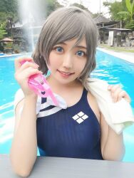 Rule 34 | 1girl, blue eyes, competition swimsuit, cosplay, cosplay photo, grey hair, highres, looking at viewer, love live!, love live! sunshine!!, mi yan 0728, on water, one-piece swimsuit, photo (medium), pool, short hair, smile, swim cap, swim goggles, swimsuit, towel, watanabe you