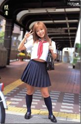 Rule 34 | 1girl, asian, av idol, bag, blue socks, handbag, looking at viewer, midriff, nagase ai, photo (medium), school uniform, serafuku, skirt, smile, socks, solo, standing, v