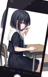 1girl black_eyes black_hair black_serafuku blush cellphone commentary_request desk expressionless highres looking_at_viewer na-ga original phone school_uniform serafuku short_hair sitting skirt smartphone solo v