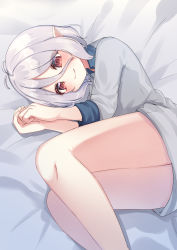 Rule 34 | 1girl, antenna hair, bed sheet, closed mouth, collared shirt, commentary request, feet out of frame, grey pajamas, grey shirt, hair between eyes, hands up, highres, kokkoro (princess connect!), long sleeves, looking at viewer, lying, on side, pajamas, pointy ears, princess connect!, red eyes, shirt, silver hair, smile, solo, split mouth, suzu (minagi)
