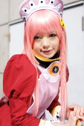 Rule 34 | 1girl, apron, asian, blurry, braid, breasts, broom, cosplay, cowboy shot, depth of field, dress, highres, light smile, looking at viewer, maid, maid apron, makeup, mascara, namada, nono (top wo nerae 2!), outdoors, photo (medium), pink hair, puffy sleeves, side braid, sidelocks, small breasts, solo, top wo nerae 2!