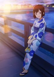Rule 34 | 1girl, :d, bag, blush, bridge, brown hair, building, fence, floral print, hibike! euphonium, highres, holding, holding bag, japanese clothes, kamo kamen, kimono, leaning, leaning back, lens flare, looking at viewer, mole, mole under eye, obi, open mouth, red eyes, river, sandals, sash, short hair, smile, solo, standing, water