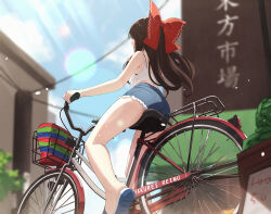 1girl ass bare_arms bare_legs bicycle bow breasts casual character_name commentary_request from_below hair_bow hakurei_reimu highres long_hair medium_breasts oeyama outdoors riding riding_bicycle short_shorts shorts solo touhou