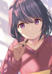 Rule 34 | 1girl, close-up, closed mouth, file112056, hair between eyes, highres, holding, holding pen, leaning on table, light, light particles, long hair, long sleeves, looking at viewer, pen, purple eyes, red sweater, shima rin, simple background, solo, sweater, table, window shadow, yurucamp