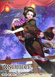 Rule 34 | 1girl, black hair, cherry blossoms, commentary request, copyright name, falling petals, feet out of frame, floral print kimono, hair ornament, hand fan, highres, holding, holding fan, kanzashi, lantern, looking to the side, nico robin, night, obi, official art, one piece, one piece card game, outstretched arm, petals, pink petals, red lips, sash, sidelocks, smile, solo, sunohara (encount), wide sleeves