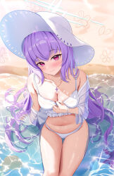 Rule 34 | 1girl, absurdres, atsuko (blue archive), atsuko (swimsuit) (blue archive), bare legs, bare shoulders, beach, bikini, blue archive, blush, breasts, cleavage, closed mouth, day, feet out of frame, halo, hat, highres, jacket, kesa pasa, long hair, long sleeves, looking at viewer, medium breasts, navel, ocean, official alternate costume, open clothes, open jacket, outdoors, purple hair, red eyes, see-through, see-through jacket, sitting, smile, solo, sun hat, swimsuit, water, white bikini, white hat