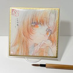 1girl art_tools_in_frame close-up head_rest highres kaede_(shijie_heping) long_hair looking_at_viewer orange_eyes orange_hair original painting_(medium) photo_(medium) smile solo traditional_media upper_body watercolor_(medium)