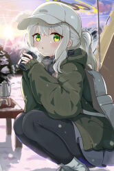 Rule 34 | 1girl, absurdres, backpack, bag, black pantyhose, blue archive, blush, boots, commentary, cup, green eyes, green jacket, grey footwear, grey hair, grey skirt, hair between eyes, halo, hare (blue archive), hare (camp) (blue archive), hat, highres, holding, holding cup, jacket, long hair, long sleeves, looking at viewer, mikumiku37, official alternate costume, outdoors, pantyhose, parted lips, ponytail, skirt, solo, squatting, white hat