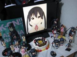 Rule 34 | 1girl, 2d dating, birthday, black hair, cake, figure, food, hands on own cheeks, hands on own face, happy birthday, k-on!, lonely, long hair, monitor, nakano azusa, nendoroid, photo (medium), school uniform, twintails