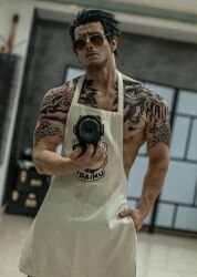 Rule 34 | 1boy, apron, arm tattoo, black hair, blurry, blurry background, camera, chest tattoo, closed mouth, cosplay photo, cowboy shot, dutch angle, earrings, facial hair, gokushufudou, hair slicked back, highres, holding, holding camera, jewelry, looking at viewer, male focus, muscular, muscular male, mustache, nipple slip, nipples, pectorals, photo (medium), short hair, sidepec, solo, sunglasses, taryn cosplay, tatsu (gokushufudou), tattoo, white apron