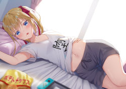 Rule 34 | 1girl, alexmaster, armpit peek, armpits, bed sheet, black shorts, blonde hair, blue eyes, blurry, bow, clothes lift, clothes writing, collarbone, commentary request, depth of field, hair bow, long hair, looking at viewer, lying, midriff, navel, nintendo switch, on back, on bed, open mouth, original, pillow, shirt, shirt lift, short shorts, short sleeves, shorts, solo, twintails, white shirt
