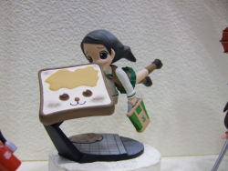 Rule 34 | 1girl, :3, bag, black hair, blue eyes, bread slice, butter, eating, figure, flying, food, food in mouth, mouth hold, photo (medium), satchel, school uniform, serafuku, solo, toast, toast in mouth, what