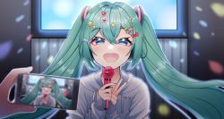 Rule 34 | 1girl, 1other, blue eyes, blurry, blurry foreground, bow, green hair, grey hoodie, hair bow, hair ornament, hairclip, hands up, hatsune miku, highres, holding, holding microphone, holding phone, hood, hood down, hoodie, long hair, long sleeves, masumofu, microphone, nail polish, phone, red nails, solo focus, star (symbol), star hair ornament, taking picture, twintails, vocaloid