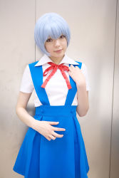 Rule 34 | 1girl, asian, ayanami rei, ayanami rei (cosplay), blue hair, breasts, color contacts, cosplay, cowboy shot, highres, indoors, looking at viewer, makeup, mascara, miniskirt, namada, neon genesis evangelion, photo (medium), red eyes, school uniform, short hair, skirt, small breasts, solo, standing