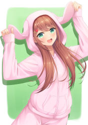 Rule 34 | 1girl, 7fuji 06, absurdres, animal hood, arms up, blush, border, brown hair, clothes grab, commentary request, cowboy shot, green background, green eyes, highres, hood, hood up, hoodie, leaning to the side, long hair, looking at viewer, open mouth, original, pajamas, pants, pink hoodie, pink pants, pocket, rabbit hood, sidelocks, simple background, smile, solo, white border