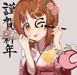 Rule 34 | 1girl, ;p, absurdres, anglerfish, brown eyes, brown hair, calligraphy brush, commentary, emblem, facepaint, fish, floral print, flower, girls und panzer, grey background, hagoita, hair flower, hair ornament, hanetsuki, head tilt, highres, holding, holding brush, japanese clothes, kimono, lazurite (user 8870367), new year, nishizumi miho, one eye closed, paddle, paintbrush, pink flower, pink kimono, print kimono, short hair, solo, text background, tongue, tongue out, translated