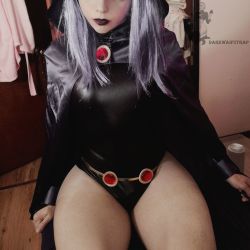 Rule 34 | 1boy, androgynous, bare legs, black leotard, bulge, cape, cosplay, darkwaifutrap, dc comics, highleg, highleg leotard, highres, hood, hoodie, leotard, lipstick, makeup, on bed, photo (medium), raven (dc), raven (dc) (cosplay), shiny clothes, sitting, skin tight, skindentation, teen titans, trap, wide hips
