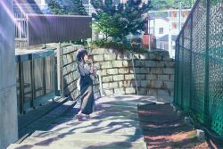 Rule 34 | 1girl, absurdres, apartment, bag, black hair, black skirt, brown eyes, building, chain-link fence, city, commentary request, dappled sunlight, eating, fence, food, highres, holding, holding food, long skirt, looking at viewer, looking back, michinoku (hiking miusan18), original, overall skirt, pink footwear, scenery, shadow, shirt, shoulder bag, skirt, solo, stairs, standing, stone wall, sunlight, tree, walking, wall, white shirt, window