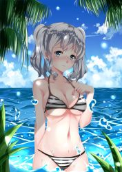 Rule 34 | 1girl, absurdres, arm behind back, bikini, blue eyes, blush, breasts, chahei, cloud, cloudy sky, collarbone, day, grey eyes, hand on own chest, highres, kantai collection, kashima (kancolle), large breasts, ocean, palm tree, sky, solo, striped bikini, striped clothes, swimsuit, tree, twintails, underboob, wading, wavy hair