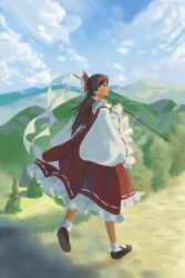 Rule 34 | 1girl, black skirt, blue sky, bow, brown hair, cloud, commentary, detached sleeves, full body, gohei, green snake (grnsnk), hair bow, hakurei reimu, highres, long hair, looking back, mountainous horizon, outdoors, pom pom (clothes), red bow, red skirt, ribbon-trimmed skirt, ribbon trim, shirt, skirt, sky, socks, solo, symbol-only commentary, touhou, tree, white shirt, white socks, wide sleeves
