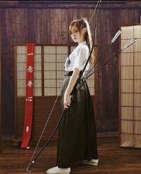 1girl archery arrow_(projectile) bow bow_(weapon) dojo female_focus hakama japanese_(nationality) japanese_clothes kimono lowres ponytail weapon wooden_floor yukata