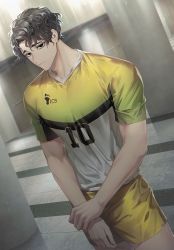 Rule 34 | 1boy, black eyes, black hair, closed mouth, expressionless, haikyuu!!, hand on own arm, hemoon, holding own arm, indoors, looking at viewer, male focus, mole, sakusa kiyoomi, short sleeves, shorts, solo, sportswear, volleyball uniform, yellow shorts