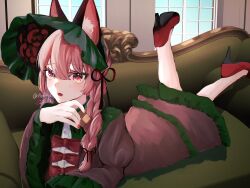 1girl alternate_costume animal_ear_fluff animal_ears aoringo_orin black_footwear bow braid cat_ears cat_girl commentary_request couch dress full_body headdress high_heels indoors kaenbyou_rin looking_at_viewer lying on_stomach open_mouth red_bow red_dress red_eyes red_hair red_nails side_braids sitting solo touhou touhou_gensou_eclipse twin_braids twitter_username window