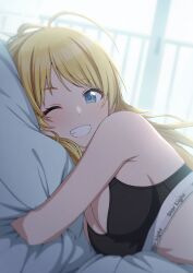 Rule 34 | 1girl, ahoge, amochin, bare shoulders, bed, bed sheet, black bra, blonde hair, blue eyes, blush, bra, breasts, cleavage, clothes writing, commentary, grin, hachimiya meguru, highres, idolmaster, idolmaster shiny colors, large breasts, long hair, looking at viewer, lying, hugging object, on bed, on side, one eye closed, pillow, pillow hug, smile, solo, teeth, underwear, underwear only