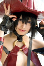 Rule 34 | 1girl, arc system works, bare shoulders, black gloves, black hair, blue eyes, closed mouth, clothes writing, collarbone, cosplay, cosplay photo, flat chest, gloves, guilty gear, hair between eyes, hand on headwear, hands up, hat, i-no, lips, looking at viewer, nail polish, o-ring, photo (medium), red hat, red nails, revealing clothes, short hair, simple background, solo, upper body, white background