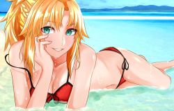 Rule 34 | 1girl, aqua eyes, beach, bikini, black ribbon, blonde hair, braid, breasts, cleavage, collarbone, crown braid, day, fate/grand order, fate (series), front-tie bikini top, front-tie top, grin, groin, halterneck, head rest, highres, long hair, looking at viewer, lying, medium breasts, mordred (fate), mordred (fate) (all), mordred (fate/apocrypha), mordred (swimsuit rider) (fate), mordred (swimsuit rider) (first ascension) (fate), navel, off shoulder, on stomach, outdoors, red bikini, ribbon, shiny skin, side-tie bikini bottom, smile, solo, swimsuit, tomotomow00w