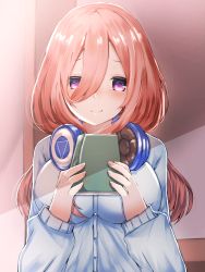 Rule 34 | 1girl, blue cardigan, blush, book, brown hair, cardigan, closed mouth, commentary request, go-toubun no hanayome, hair between eyes, headphones, headphones around neck, highres, holding, holding book, long hair, looking at viewer, makoto-0726, nakano miku, purple eyes, smile, solo, upper body