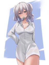 Rule 34 | 1girl, alternate costume, blue background, breasts, cleavage, commentary request, condom, condom in mouth, cowboy shot, green eyes, grey hair, hair between eyes, hand on own hip, highres, kantai collection, kashima (kancolle), lanthan, long sleeves, medium breasts, medium hair, mouth hold, naked shirt, shirt, solo, twintails, white background