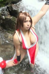 Rule 34 | breasts, brown eyes, brown hair, chouzuki maryou, cosplay, hand fan, hair ornament, hanging breasts, large breasts, long hair, photo (medium), plump, ponytail, shiranui mai, shiranui mai (cosplay), snk, the king of fighters, thick thighs, thighs, very long hair