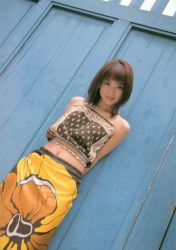 1girl asian brown_hair dutch_angle female_focus halterneck ichikawa_yui looking_at_viewer midriff photo_(medium) skirt smile solo