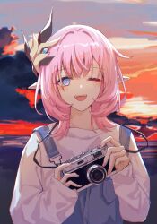 Rule 34 | 1girl, blue eyes, camera, cloud, commentary request, elysia (honkai impact), hair ornament, highres, holding, holding camera, honkai (series), honkai impact 3rd, long hair, long sleeves, looking at viewer, nail polish, one eye closed, open mouth, outdoors, overalls, pink hair, pink nails, pointy ears, rio3237337810, rio (user kzxp8757), shirt, sky, sleeves past wrists, solo, sunset, upper body, white shirt