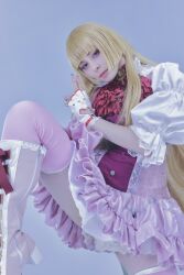 1girl blonde_hair blue_eyes boots cosplay emilie_de_rochefort emilie_de_rochefort_(cosplay) fingerless_gloves gloves high_heels highres long_hair looking_at_viewer nail_polish photo_(medium) real_life standing standing_on_one_leg tekken tekken_8 thighs yuriko_tiger