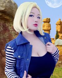Rule 34 | 1girl, android 18, android 18 (cosplay), blonde hair, blue eyes, breasts, clothes, clothes grab, cosplay, dragonball z, female focus, grabbing, highres, large breasts, lipstick, looking at viewer, makeup, medium hair, model, shibuya kaho, solo, wig