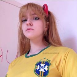 Rule 34 | 1girl, blue eyes, brazil, brazilian (nationality), brazilian flag, breasts, brown hair, cosplay, expressionless, freckles, hairpods, interface headset, lips, looking at viewer, medium breasts, memepantazis, neon genesis evangelion, photo (medium), real life, shirt, soccer uniform, solo, souryuu asuka langley, souryuu asuka langley (cosplay), sportswear, standing, twintails, twitter username, two side up, upper body