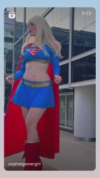 Rule 34 | 1girl, animated, argentine (nationality), audible music, blonde hair, bracelet, breasts, cape, cleavage, clenched hands, cosplay, curvy, dc comics, double bun, dress, fighting stance, hair bun, highres, jewelry, lips, lipstick, long hair, looking at viewer, makeup, medium breasts, miniskirt, navel, photo (medium), real life, red cape, simple background, skirt, smile, sophie valentine, sound, spiked bracelet, spikes, standing, supergirl, supergirl (cosplay), superhero costume, superman (series), tagme, thighs, video, wide hips