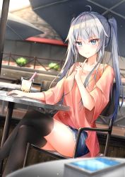 Rule 34 | 1girl, beliatan, black thighhighs, blue eyes, blurry, blurry background, blush, bubble tea, closed mouth, collarbone, day, denim, denim shorts, depth of field, eyes visible through hair, feet out of frame, finger to own chin, hand up, highres, index finger raised, long hair, looking at viewer, loose clothes, loose shirt, mole, mole under eye, outdoors, parasol, phone, red shirt, restaurant, shirt, shorts, sidelocks, silver hair, sitting, solo, table, thighhighs, twintails, umbrella, wavy mouth